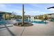 Inviting community pool with lounge chairs, tables, and desert landscaping at 5100 E Rancho Paloma E Dr # 1046, Cave Creek, AZ 85331