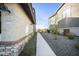 A well-maintained side yard with a paved walkway, desert landscaping and mountain views at 5100 E Rancho Paloma E Dr # 1046, Cave Creek, AZ 85331