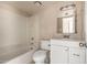 Functional bathroom featuring a shower-tub combination, a vanity with a sink, and a toilet at 5254 N 42Nd Pkwy, Phoenix, AZ 85019