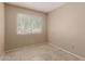 Neutral bedroom with tiled floors and a window at 5254 N 42Nd Pkwy, Phoenix, AZ 85019