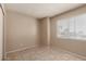 Neutral bedroom with tiled floors, natural light coming through the window at 5254 N 42Nd Pkwy, Phoenix, AZ 85019