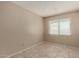 Neutral bedroom with tiled floors and a window at 5254 N 42Nd Pkwy, Phoenix, AZ 85019