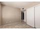 Neutral bedroom with tiled floors and closet at 5254 N 42Nd Pkwy, Phoenix, AZ 85019