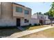 Two-story townhome featuring multiple windows, secure front door and low maintenance landscaping at 5254 N 42Nd Pkwy, Phoenix, AZ 85019