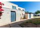 Charming two-story home with blue door and freshly landscaped front yard, and desert landscaping at 5254 N 42Nd Pkwy, Phoenix, AZ 85019