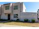 Two-story townhome with low-maintenance landscaping, secure front entry, and white lattice fence at 5254 N 42Nd Pkwy, Phoenix, AZ 85019