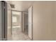 Inviting hallway with neutral tones and tiled flooring, leading to various rooms in the home at 5254 N 42Nd Pkwy, Phoenix, AZ 85019