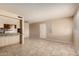 Inviting living area with tile floors, bright natural light and kitchen bar at 5254 N 42Nd Pkwy, Phoenix, AZ 85019