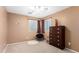 Bedroom featuring a ceiling fan, a window with natural light, and a dresser at 5749 S 249Th Dr, Buckeye, AZ 85326