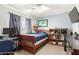 Cozy bedroom featuring a comfortable bed and window with natural light at 5749 S 249Th Dr, Buckeye, AZ 85326