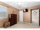 Bedroom featuring a ceiling fan, a window with natural light, and a dresser at 5749 S 249Th Dr, Buckeye, AZ 85326