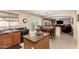 Eat-in kitchen with granite counters, dark appliances, and a cozy dining area overlooking the backyard at 5749 S 249Th Dr, Buckeye, AZ 85326
