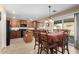 Bright dining area featuring a sliding glass door and a table with seating for six at 5749 S 249Th Dr, Buckeye, AZ 85326