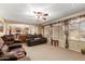 Spacious living room featuring tan carpet, neutral walls, and natural light at 5749 S 249Th Dr, Buckeye, AZ 85326