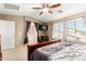 Inviting main bedroom with natural light and en-suite bathroom at 5749 S 249Th Dr, Buckeye, AZ 85326