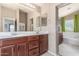 Bathroom featuring dual vanities, framed mirrors and ample counter space at 581 W Angus Rd, San Tan Valley, AZ 85143