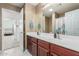 Bathroom featuring dual vanities, framed mirrors, and ample counter space at 581 W Angus Rd, San Tan Valley, AZ 85143