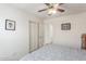 Bedroom with a ceiling fan, double door closet and neutral color palette at 581 W Angus Rd, San Tan Valley, AZ 85143