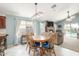 Cozy dining area with natural light, adjacent to an inviting living room with a fireplace at 581 W Angus Rd, San Tan Valley, AZ 85143