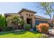 Inviting single-story home with a well-manicured lawn and mature desert landscaping at 581 W Angus Rd, San Tan Valley, AZ 85143