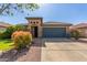 Charming single-story home with a two-car garage and mature desert landscaping at 581 W Angus Rd, San Tan Valley, AZ 85143