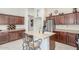 Well-appointed kitchen with a central island, stainless steel appliances, and ample storage at 581 W Angus Rd, San Tan Valley, AZ 85143