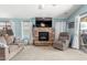 Comfortable living room featuring a stone fireplace and relaxing seating at 581 W Angus Rd, San Tan Valley, AZ 85143