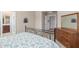 Spacious bedroom with dresser, carpet, and an open en-suite bathroom at 581 W Angus Rd, San Tan Valley, AZ 85143