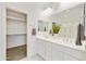 Bathroom boasting a double sink vanity, stylish decor, and a convenient walk-in closet at 5854 S Del Rancho --, Mesa, AZ 85212