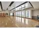 Bright dance studio with hardwood floors, mirrors, and fitness equipment at 5854 S Del Rancho --, Mesa, AZ 85212