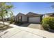 Beautiful single-story home with a well-maintained lawn and a two-car garage at 5854 S Del Rancho --, Mesa, AZ 85212