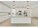 Bright kitchen with a large island, white cabinets, and stainless steel appliances at 5854 S Del Rancho --, Mesa, AZ 85212