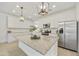 Modern kitchen features a large island, granite countertops, and stainless steel appliances at 5854 S Del Rancho --, Mesa, AZ 85212