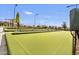 Community lawn bowling court with manicured green and ample seating at 5854 S Del Rancho --, Mesa, AZ 85212