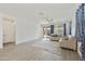 Light-filled living room features tile flooring, neutral walls, and an airy open layout at 5854 S Del Rancho --, Mesa, AZ 85212
