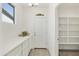 Convenient mud room includes built-in cabinets, countertop space, and adjacent access to a walk-in pantry at 5854 S Del Rancho --, Mesa, AZ 85212