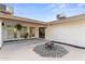 Backyard patio area with fire pit and well-maintained landscaping at 6134 E Hannibal St, Mesa, AZ 85205