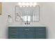 Modern bathroom vanity with dual sinks, matte black fixtures, and ample storage at 6134 E Hannibal St, Mesa, AZ 85205