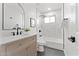 Stylish bathroom featuring a modern vanity, tub with shower, and sleek black fixtures at 6134 E Hannibal St, Mesa, AZ 85205
