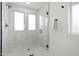 A renovated bathroom features a glass-enclosed shower and modern fixtures at 6134 E Hannibal St, Mesa, AZ 85205