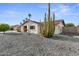 Single-story home with desert landscaping and an interesting cactus adding to the curb appeal at 6134 E Hannibal St, Mesa, AZ 85205