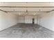 Spacious garage with concrete flooring and white walls, providing ample parking and storage at 6134 E Hannibal St, Mesa, AZ 85205