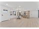 Modern open-concept kitchen with an island, dining area, and ample cabinet space at 6134 E Hannibal St, Mesa, AZ 85205