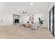Bright living room with fireplace, stylish furnishings, and access to the backyard at 6134 E Hannibal St, Mesa, AZ 85205