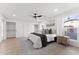 The main bedroom features natural light, a ceiling fan, and closet at 6134 E Hannibal St, Mesa, AZ 85205