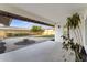 Covered patio with outdoor seating area and a view of the landscaped backyard at 6134 E Hannibal St, Mesa, AZ 85205