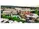 Aerial shot of community amenities, including a pool, pond, clubhouse and well-manicured landscaping at 7960 E Camelback Rd # 209, Scottsdale, AZ 85251