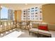 Relaxing balcony area with furniture and views of the surrounding buildings at 7960 E Camelback Rd # 209, Scottsdale, AZ 85251