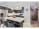 Modern kitchen featuring sleek countertops, stainless steel appliances, and a breakfast bar with seating at 7960 E Camelback Rd # 209, Scottsdale, AZ 85251