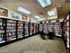 Inviting library with floor-to-ceiling bookshelves, cozy seating, and a peaceful ambiance for reading and studying at 7960 E Camelback Rd # 209, Scottsdale, AZ 85251